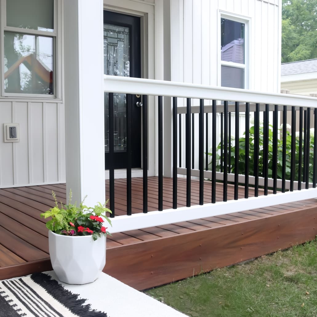 image of white vinyl deck railing with square black balusters