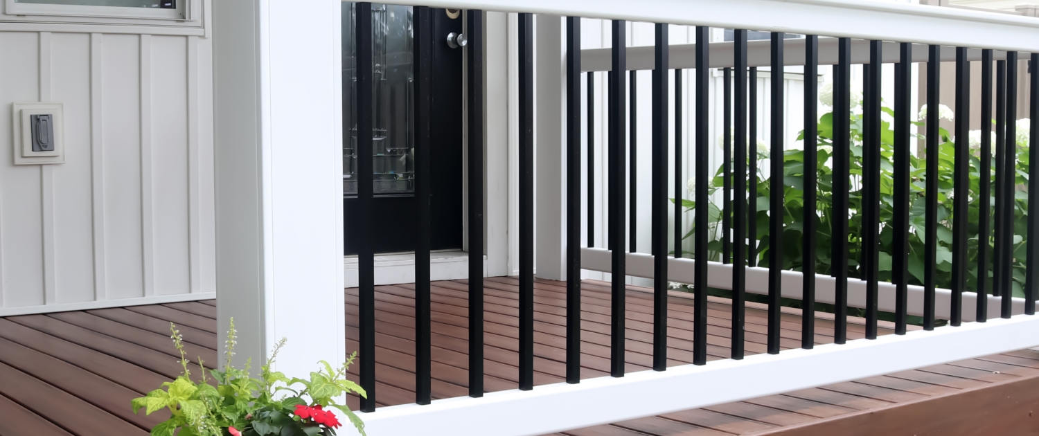 image of white vinyl deck railing with square black balusters