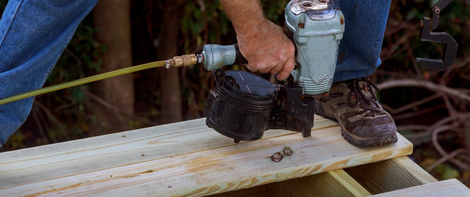 Photo of a carpenter building a wood deck