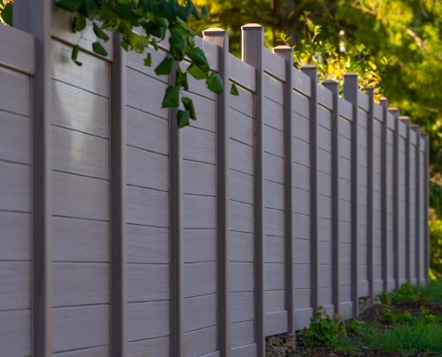 Brown vinyl fencing with horizontal slats