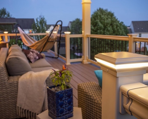 White vinyl railing with post cap lighting