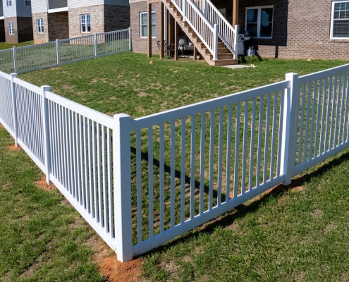 white vinyl picket yard fence