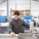 A local fence company worker creating and manufacturing a fence.